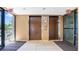 Elevators at a condo complex with tile floors, signage, and exit doors to the exterior at 7321 Central Ave # 503, St Petersburg, FL 33710