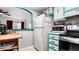 Cozy kitchen area features modern appliances and breakfast bar at 7321 Central Ave # 503, St Petersburg, FL 33710