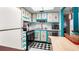 Bright kitchen with updated stainless steel appliances, white cabinets, and ample counter space at 7321 Central Ave # 503, St Petersburg, FL 33710