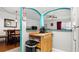 Kitchen view featuring breakfast bar and dining area with modern decor and stainless steel appliances at 7321 Central Ave # 503, St Petersburg, FL 33710