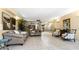 Spacious lobby featuring tiled floor, sofas, chairs and a partial view of a front desk and mailboxes at 7321 Central Ave # 503, St Petersburg, FL 33710