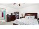 Spacious main bedroom with ceiling fan, dresser, nightstand, and large comfortable bed at 7321 Central Ave # 503, St Petersburg, FL 33710