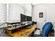 Bright office space with a desk, dual monitors, comfortable chair, and natural light from a window at 7321 Central Ave # 503, St Petersburg, FL 33710