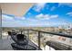 Balcony view overlooking city and landscape with table and chair set at 777 3Rd Ave N # 1403, St Petersburg, FL 33701