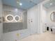 Stunning bathroom with a large glass shower, double sinks, modern tile, and gold hardware at 777 3Rd Ave N # 1403, St Petersburg, FL 33701