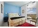 Inviting bedroom with a large window overlooking the cityscape and plush furnishings at 777 3Rd Ave N # 1403, St Petersburg, FL 33701