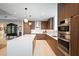 Contemporary kitchen with central island, double ovens, and plenty of cabinet space at 777 3Rd Ave N # 1403, St Petersburg, FL 33701