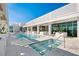 Resort-style pool and jacuzzi surrounded by lush landscaping and sun loungers at 777 3Rd Ave N # 1403, St Petersburg, FL 33701