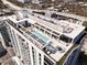 Aerial view of the rooftop amenity area with pool and outdoor seating at 777 3Rd Ave N # 1403, St Petersburg, FL 33701