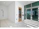 Walk-in shower features white tile and glass doors at 777 3Rd Ave N # 1403, St Petersburg, FL 33701