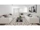 Bright living room showcases modern decor, neutral tones, and ample seating, creating a cozy atmosphere at 7797 Peace Lily Ave, Wesley Chapel, FL 33545