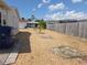 Backyard featuring a pea gravel ground cover, landscaping, and a wooden fence at 7812 Heather St, New Port Richey, FL 34653