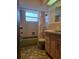 Bathroom featuring a tub with shower, and a vanity with a decorative shower curtain at 7812 Heather St, New Port Richey, FL 34653