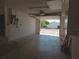 Garage with an open door showcasing a view to the street and exterior at 7812 Heather St, New Port Richey, FL 34653