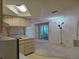 Eat-in kitchen featuring skylight and chandelier at 7812 Heather St, New Port Richey, FL 34653