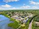 Coastal home on the water featuring lush greenery, a private dock, and neighborhood charm at 826 Christina Cir, Oldsmar, FL 34677