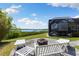 This backyard oasis features a waterfront view and outdoor seating area at 826 Christina Cir, Oldsmar, FL 34677