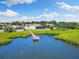 Scenic backyard view with private dock access and lush surroundings, offering waterfront living at 826 Christina Cir, Oldsmar, FL 34677