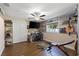 Spacious bedroom featuring wood-look flooring, ceiling fan and custom display shelving at 826 Christina Cir, Oldsmar, FL 34677