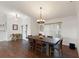 An expansive dining area with a large table, stylish seating, and dark wood flooring at 826 Christina Cir, Oldsmar, FL 34677