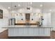 Stylish kitchen with granite countertops, a large island, and stainless steel appliances, perfect for cooking and entertaining at 826 Christina Cir, Oldsmar, FL 34677