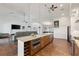 Open kitchen with stainless steel appliances, granite countertops, large island, and wine storage at 826 Christina Cir, Oldsmar, FL 34677