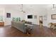 Bright living space with dining table, seating area, lake view, and access to other rooms at 826 Christina Cir, Oldsmar, FL 34677
