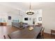 Open living space with dining table, seating area, lake view, and access to other rooms at 826 Christina Cir, Oldsmar, FL 34677