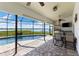 Outdoor patio area with a pool, waterfront views and outdoor dining at 826 Christina Cir, Oldsmar, FL 34677