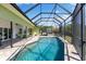 Screened pool with covered patio, featuring lounge chairs and a hot tub, perfect for relaxing at 826 Christina Cir, Oldsmar, FL 34677