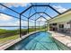This home features a large lanai with a pool and waterfront views at 826 Christina Cir, Oldsmar, FL 34677