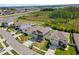 Scenic aerial view showcases well-maintained homes in a suburban community surrounded by lush greenery and serene ponds at 8607 Bower Bass Cir, Wesley Chapel, FL 33545