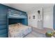 Cozy bedroom featuring a bunk bed, themed decor, and ample natural light at 8607 Bower Bass Cir, Wesley Chapel, FL 33545