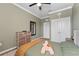 Bedroom featuring a plush bed, wood-look floors, and a dresser at 8607 Bower Bass Cir, Wesley Chapel, FL 33545