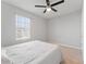 Bedroom with a window, neutral paint, and a modern ceiling fan at 8607 Bower Bass Cir, Wesley Chapel, FL 33545