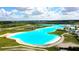 Expansive lagoon view showcases clear blue waters, sandy beaches, and beachfront recreation areas at 8607 Bower Bass Cir, Wesley Chapel, FL 33545