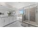Bright main bathroom with dual sinks, granite countertops, and a separate shower and tub at 8607 Bower Bass Cir, Wesley Chapel, FL 33545