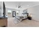Inviting main bedroom with neutral tones, ceiling fan, and plenty of natural light at 8607 Bower Bass Cir, Wesley Chapel, FL 33545