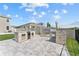 Outdoor kitchen with a built-in grill, stainless steel storage, and a stone backsplash at 8607 Bower Bass Cir, Wesley Chapel, FL 33545