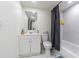 Bathroom featuring white vanity, toilet and tub with shower at 9031 Westchester Cir # 128, Tampa, FL 33604