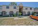 Two-story townhouse featuring a combination of beige siding and brick accents at 9031 Westchester Cir # 128, Tampa, FL 33604