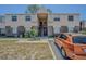 Two-story townhouse with a brick facade and light-colored siding near parking spot at 9031 Westchester Cir # 128, Tampa, FL 33604