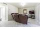 Comfortable living room with leather sofa and marble floors at 9031 Westchester Cir # 128, Tampa, FL 33604