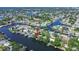 A waterfront home with dock, lush greenery, and situated on canal at 9265 Treasure Ln Ne, St Petersburg, FL 33702
