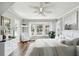 Serene bedroom featuring a cozy sitting area, water view and ample natural light at 9265 Treasure Ln Ne, St Petersburg, FL 33702