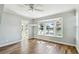Bright bedroom with wood floors and a scenic bay window overlooking the waterfront at 9265 Treasure Ln Ne, St Petersburg, FL 33702