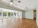 Bright living space with wood floors, ceiling fans, and panoramic views of the water at 9265 Treasure Ln Ne, St Petersburg, FL 33702