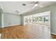 Spacious living room with hardwood floors, water views, and an open layout to the kitchen at 9265 Treasure Ln Ne, St Petersburg, FL 33702