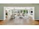 Bright living room with beautiful water view, neutral decor, and hardwood floors at 9265 Treasure Ln Ne, St Petersburg, FL 33702