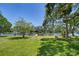 Lush backyard leading to the waterway with a private boat dock offering convenient access to boating and water activities at 9303 Alice Ln, Riverview, FL 33578